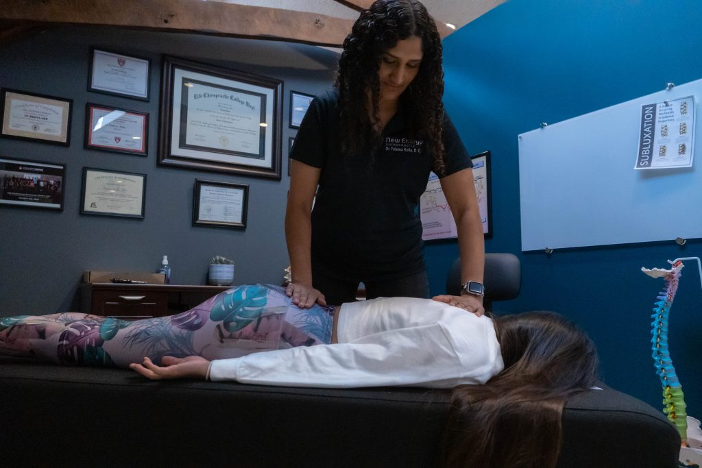 Dr Kolia Giving Chiropractic Adjustment